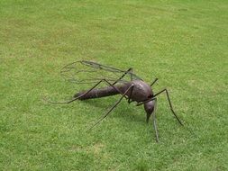 metal figure of Mosquito on grass