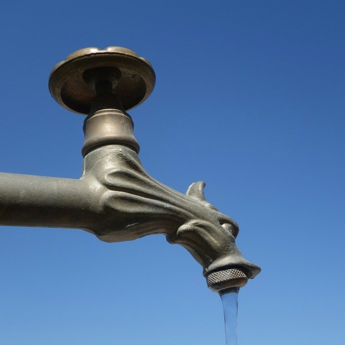 beautiful copper faucet on the street