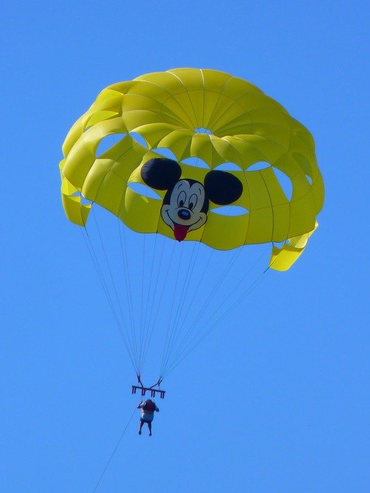 neon yellow parachute with Mickey Mouse