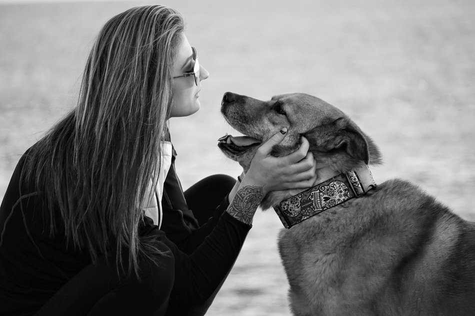 Black and white photo of girl and dog