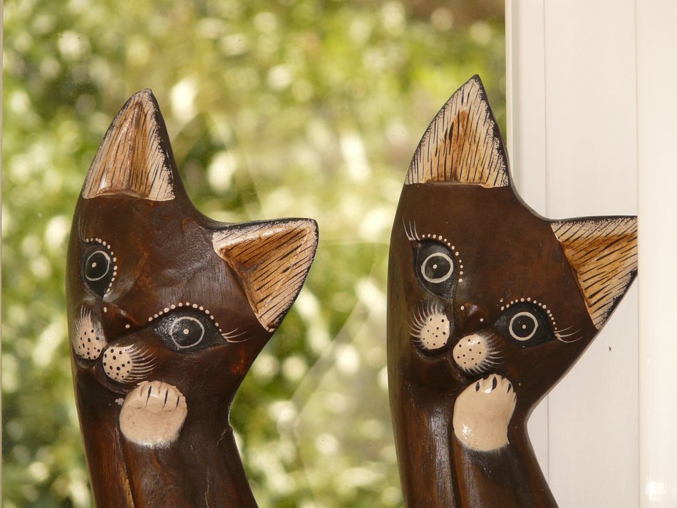 pair of wooden kittens