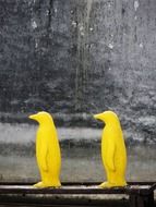 two yellow penguins as an element of decor