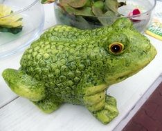 ceramic frog on the window