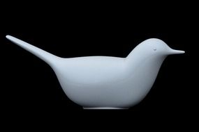 ceramic bird on a black background