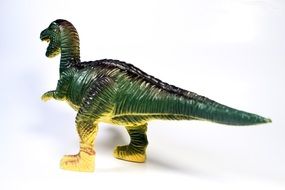 green dinosaur toy on a white background