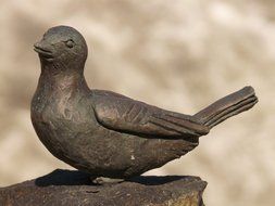 sculpture of cast iron bird