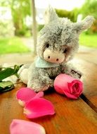 stuffed donkey toy with pink rose