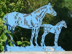 blue horses made of metal