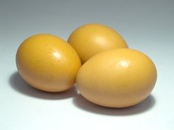 yellow eggs on a white surface