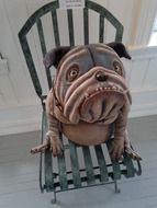 ceramic dog on the chair