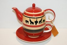 red teapot with elephants
