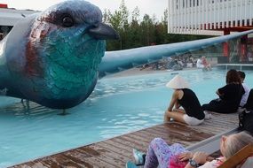 large bird statue in the pool