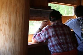 people in a log cabin