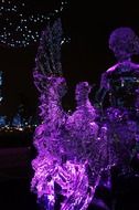 bright ice sculpture of a purple bird