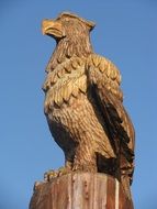 Wooden Eagle Sculpture on a castle top