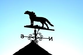 horse-shaped weather vane on the roof