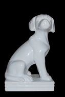 White procelain Dog Figure at black background