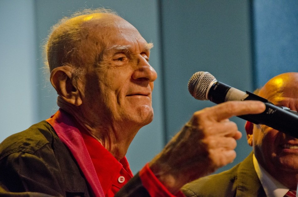 Writer with microphone on blurred background