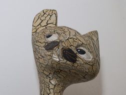 wooden figurine in the shape of a cat