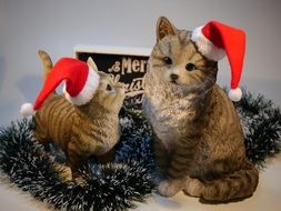 cats in Christmas hats in tinsel