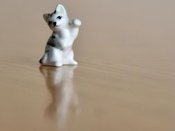 ceramic figurine of a cat on a table