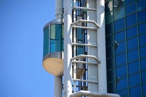 hinged transparent elevator on a skyscraper