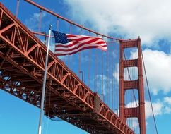 american flag on the background of the bridge