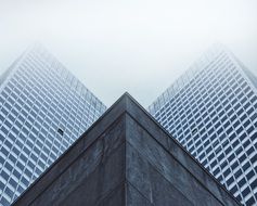 triangular skyscraper on a cloudy day