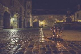 inner courtyard of the imperial palace Hofburg at night in the rain