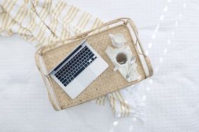 laptop and cup of tea on the table