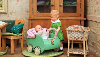 vintage Doll House interior with baby and mother dolls