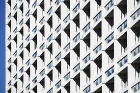 white facade of the building with windows