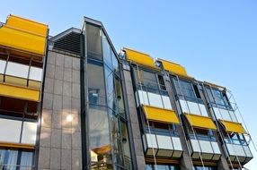 building with sun protection on the windows