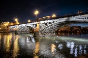 view of the bridge at night in seville