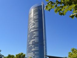 posttower skyscraper on blue sky background