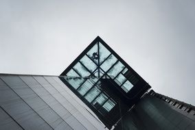 bottom view of the elevator on the facade of a building