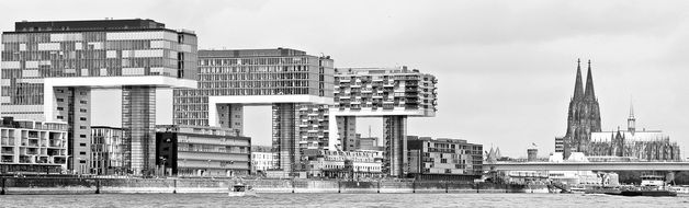 office buildings near cologne cathedral in black and white