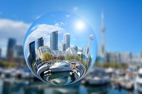 glass ball against the background of the city of toronto