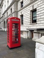 red telephone box near the building