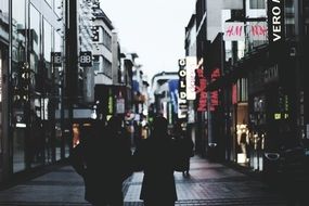 people walking near shops