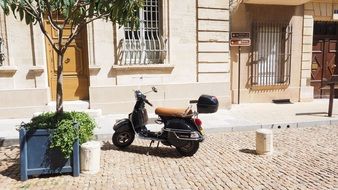 motor scooter parked on the road