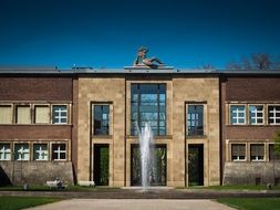 historic building with a fountain in front