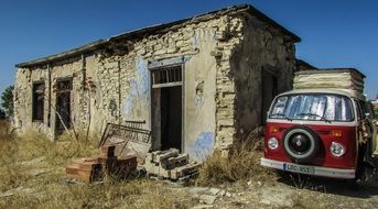 vintage red bus at old ruined building