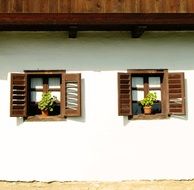 wooden shutters on the windows of a country house