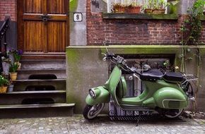 parked green scooter outdoor