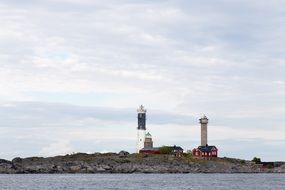 photo of lighthouses on an island in the ocean