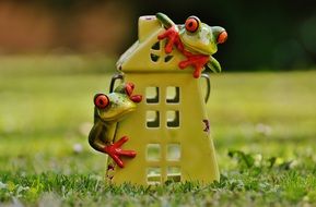 frog garden figurine near the house