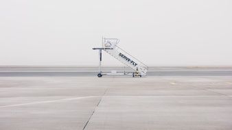 staircase for an airplane on a runway