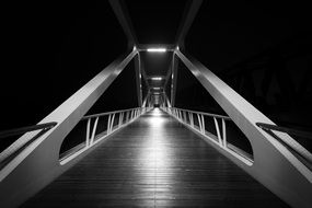 black and white photo of a modern bridge