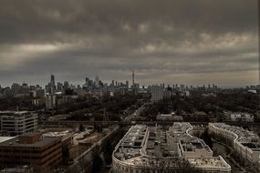 cityscape under thunder clouds